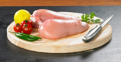 Raw chicken meat on wooden board. Healthy eating