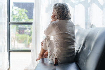 Pensive older woman lonely old senior in is home