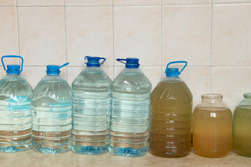 Plastic bottles with water on the floor of a house in Ukraine, bottles filled with water due to a...
