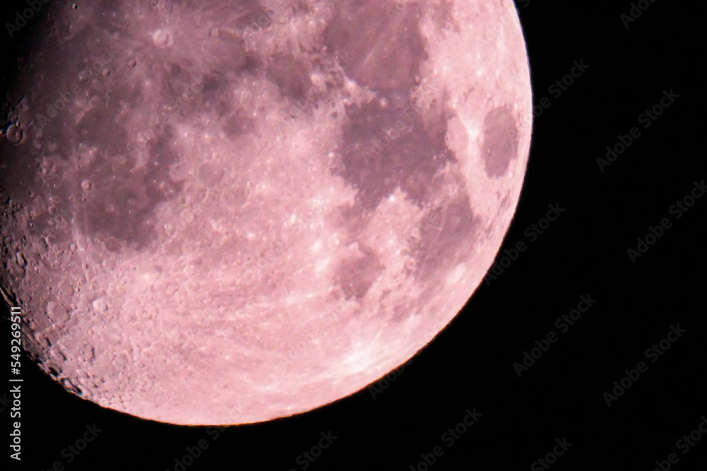 Wall mural moon at night sky. sharp footage of full moon with telephoto lens close-up. pink moon shot from grou