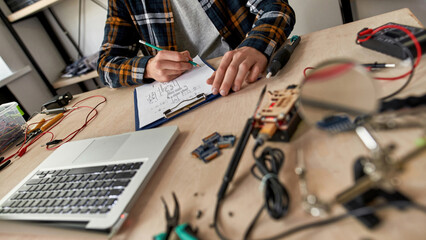 Partial IT engineer edit technical scheme at table