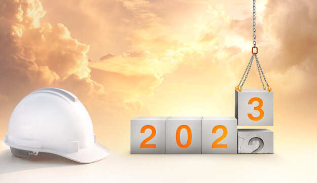 construction start working in the new year 2023. Success real estate, teamwork. Construction-crane lifting the cube and number 3 replace the year 2022 with golden sky in the background. - Powered by Adobe