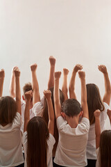 Activist kids raising hands on protest rally