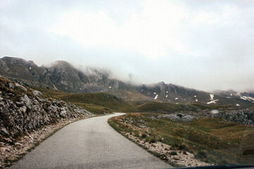 road in the mountains in rainy and foggy weather