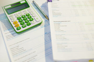 Naklejka na ściany i meble tax time. calculator and documents on desk