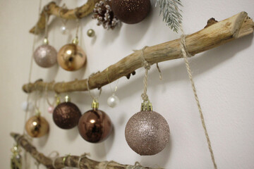shiny balls new year toys close-up on wood branches