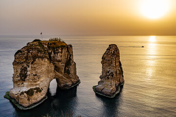 Naklejka premium Lebanon. Beirut, capital of Lebanon. Pigeon Rock at sunset