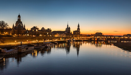 Obraz na płótnie Canvas Dresden city skyline at Elbe river and Augustus Bridge at sunset , Dresden, Saxony, Germany. Panoramic evening view of Dresden.