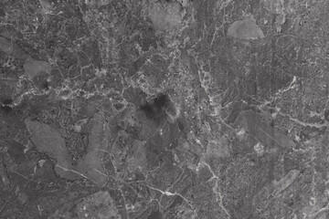 Natural marble background of black or gray marble with real patterns on it. Textured background of black marble.