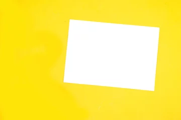 Gordijnen Blank A4 photorealistic landscape brochure mockup on yellow background © hadjanebia