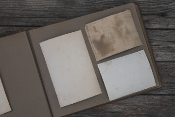 Clear blank photo frames to placed your pictures or text on old family album on wooden background...