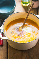 Creamy pumpkin soup with seasoning  and cream