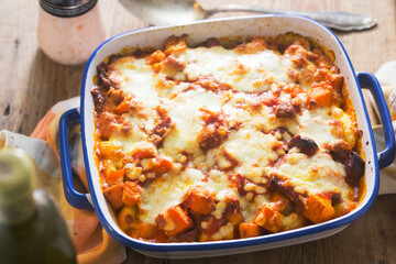 Gnocchi, pumpkin, chickpeas bale in tomato sauce with cheese 