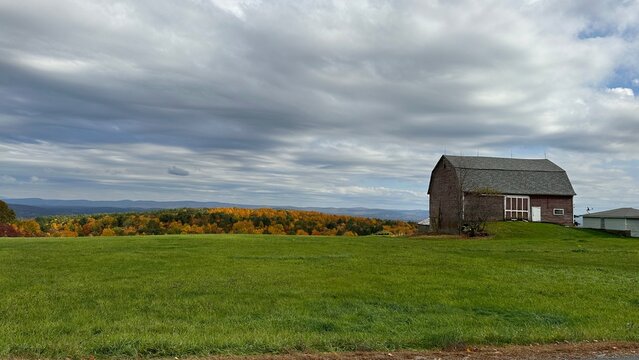 Fall Foliage and Barn Scene in Western Massachusetts with dramatic clouds