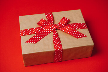 Subscription Boxes to Give and Receive. Subscription Gift Box, Care package with red ribbon on red background.