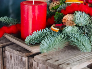 New Advent wreath with real red candles and Christmas decorations