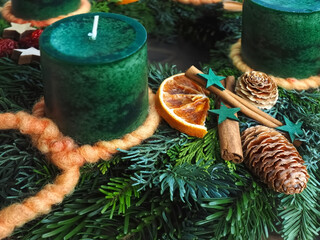 New Advent wreath with real green candles and Christmas decorations