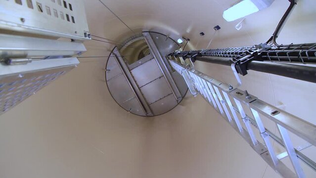 Windpipe of the turbine seen from inside the shaft with a ladder
