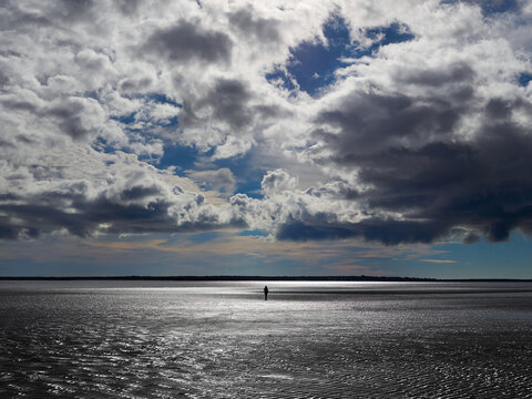 Walking on Water Below the Clouds at Sandhills Beach Provincial Park, Nova Scotia, Canada