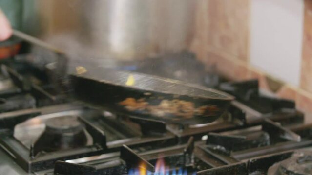 Closeup of a seafood making process on a pan