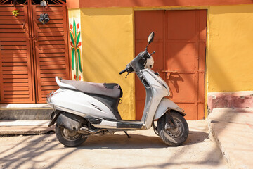 Scooter in front of traditional homes in Jodhpur city. Rajasthan, India.
