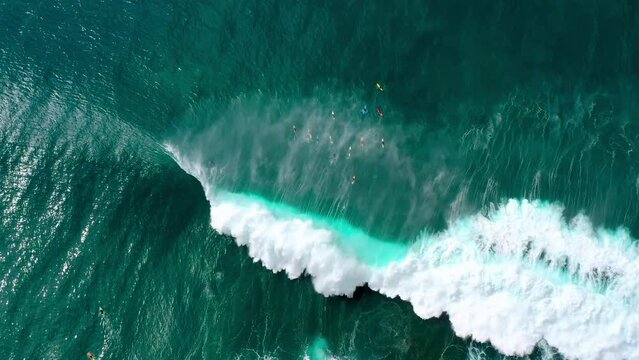 Aerial Top Backward Shot Of Tourists Surfboarding On Wavy Sea During Vacation - Waikiki, Hawaii