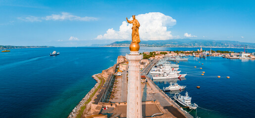 Messina, Sicily, Italy, August 20, 2022. View of the Messina's port with the gold Madonna della Lettera statue - obrazy, fototapety, plakaty