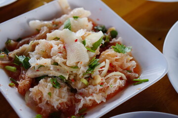 Spicy chicken feet on a plate