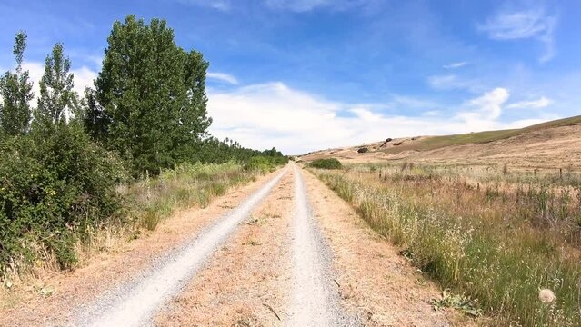 Camino de Madrid - Camino Natural Via Verde del Valle del Eresma - dual track gravel road after Los Huertos, province of Segovia, Castile and Le&oacute;n, Spain