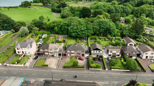 Aerial photo of Residential homes and business Streets and trees in Larne Town County Antrim Northern Ireland