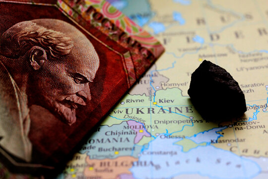 A Ruble Banknote And A Sample Of An Ore Deposit On Top Of A Map Showing Ukrain