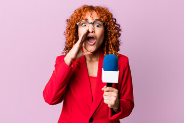 red hair pretty woman feeling happy,giving a big shout out with hands next to mouth. journalist and...