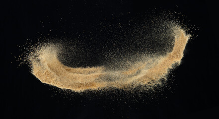 Sand flying explosion, Golden sand wave explode. Abstract sands cloud fly. Yellow colored sand...