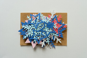 pile of paper stars and snowflakes