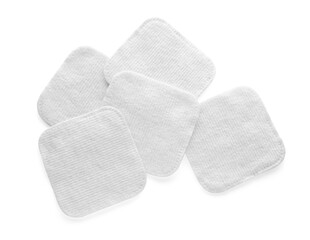 Soft clean cotton pads on white background, top view