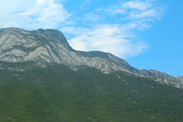 Majestic mountain landscape under blue sky with clouds