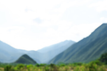 Obraz premium Blurred view of high mountains under sky outdoors