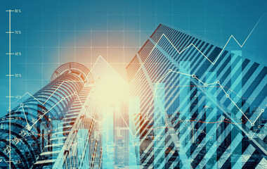 Financial graphs and digital indicators overlap with modernistic urban area, skyscrabber for stock market business concept. Double exposure.