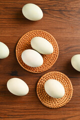 Close up colorful red yolk of salted duck eggs preserved in bamboo basket, asian style food