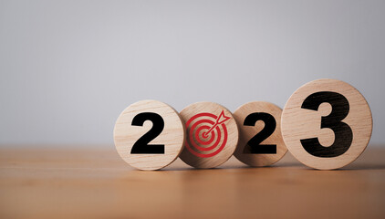 2023 year and target board print screen on wooden block cube for setup new year business objective...
