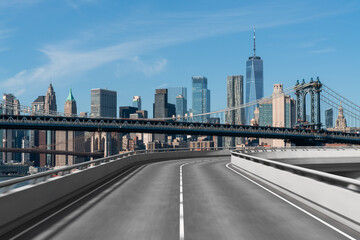 Fototapeta premium Empty urban asphalt road exterior with city buildings background. New modern highway concrete construction. Concept of way to success. Transportation logistic industry fast delivery. New York. USA.
