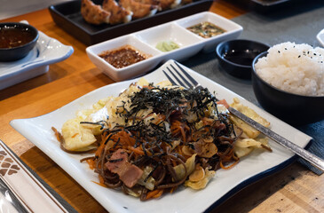Yakisoba Japanese stir fried noodles in white plate on japanese food background.