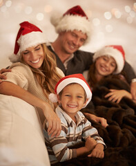 Fototapeta na wymiar Happy family, christmas hat or bonding on house or home living room sofa in celebration holiday or festive vacation event. Portrait, smile or xmas boy, girl and children and mother, father or parents