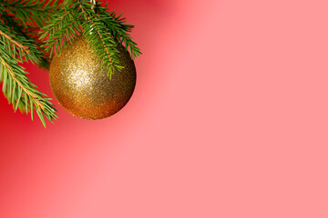 Christmas and New Year background. Beautiful festive template with a golden Christmas ball on the Christmas tree