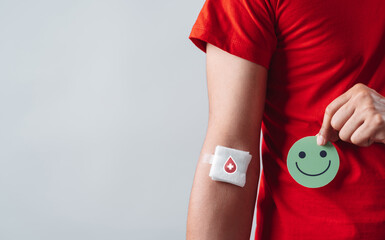 man hands holding smile face after donation blood, blood transfusion, world blood donor day, world hemophilia day concept.