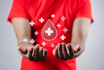 man hands holding virtual donation blood icon, blood transfusion, world blood donor day, world hemophilia day concept.