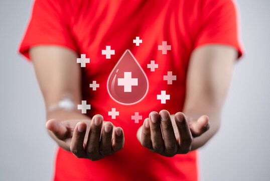 man hands holding virtual donation blood icon, blood transfusion, world blood donor day, world hemophilia day concept.