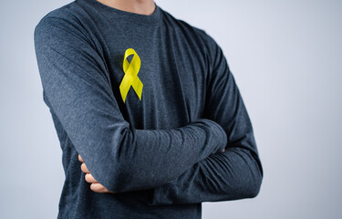 man showing yellow ribbon, september, suicide prevention day, childhood, sarcoma, bone and bladder...