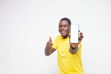 handsome Young African man holding smartphone mockup of blank screen and shows ok sign on white background