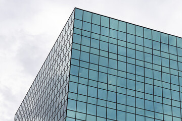 Fototapeta na wymiar Skyscraper against sky, modern tall glass office building